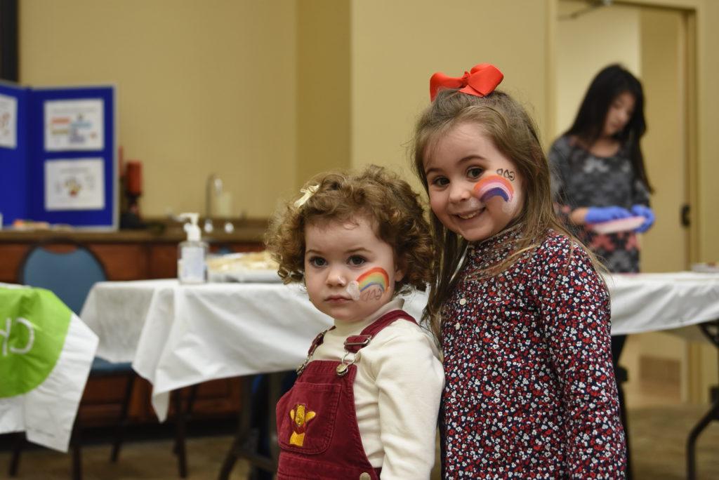 Ariunaa and Kyrea Detherage show off their face paint done by Linda Milbey at the fair. (CU Photo by Whitley Howlett)