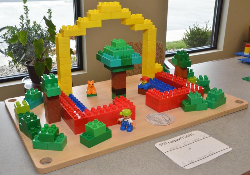 Students from Campbellsville and Taylor County schools were part of a local competition at Taylor County Public Library to create something out of LEGO bricks or MEGA Bloks. One student, Adrianna Celis, age 9, decided to recreate Campbellsville University's Alumni & Friends Park, Noe Plaza with MEGA Blocks, complete with benches, trees, a construction worker, CU sidewalk signage and the Taylor Fountain. (Campbellsville University Photo by Drew Tucker)